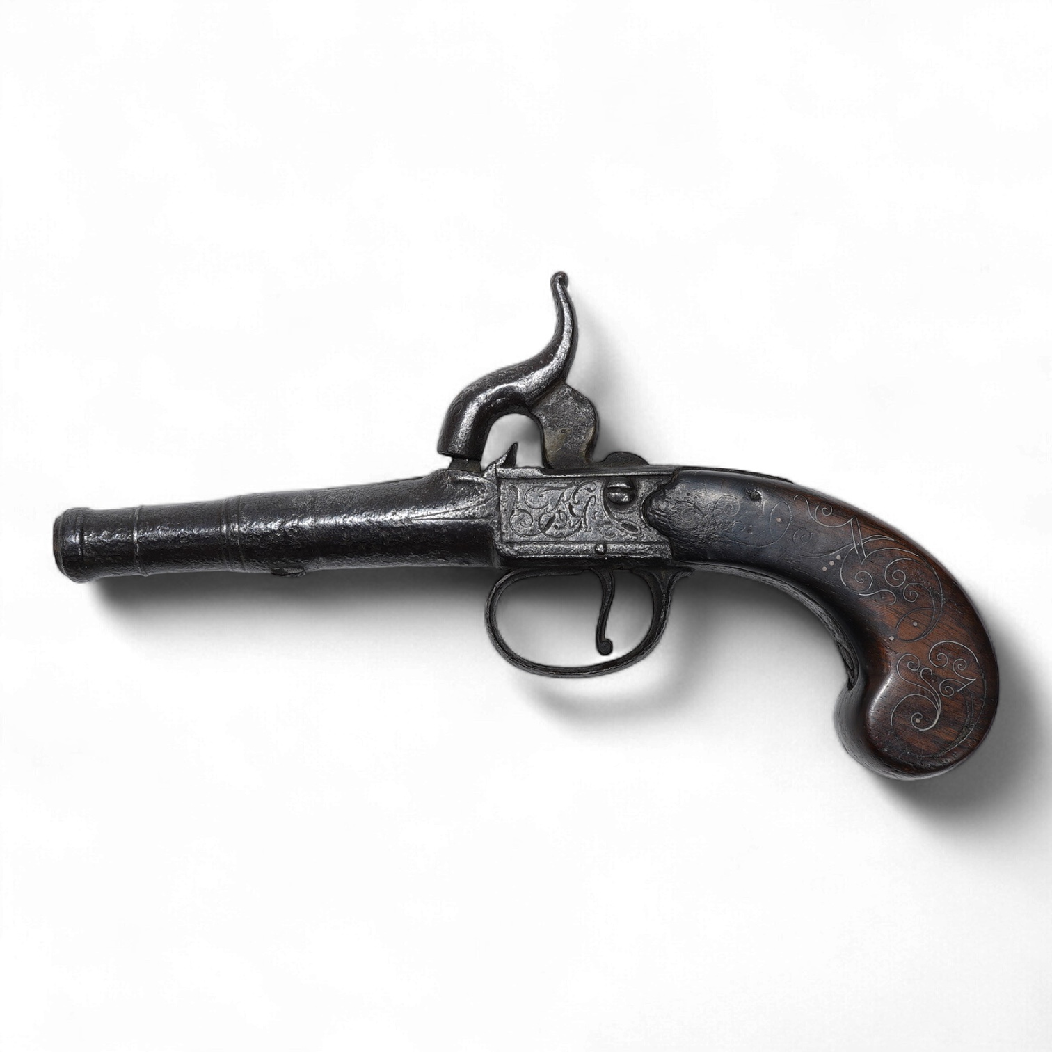 A boxlock percussion travelling pistol, with turn off cannon barrel, 5cm, and London proof marks, frame engraved; TG, with slab walnut grip with silver wire inlay